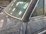 an old car with a broken windshield and a broken window