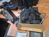 a box of electronics sitting on a desk next to a laptop