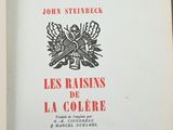 an open book with a picture of a bird on the cover
