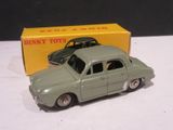 a toy car that is sitting in front of a box