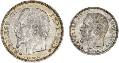a silver coin with the head of a man in profile and the head of a woman in profile