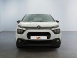 the front of a white citrole parked in a white room