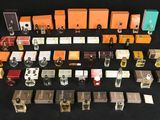 many different types of perfumes on a black surface