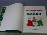 an open book with a picture of a couple of people on it