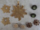 several pieces of jewelry are laying out on a table