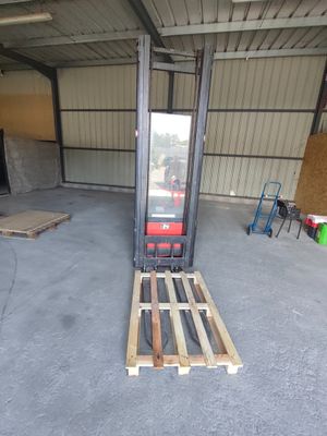 a forklift that is sitting in a garage