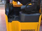 a forklift truck that is parked in a warehouse