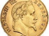 Gros plan sur une pièce d'or portant une tête d'homme