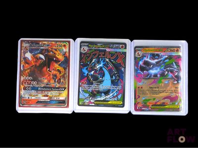 three different pokemon cards sitting on top of each other on a table