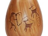a wooden vase with a picture of animals and people on it