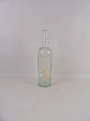 a small glass bottle with a yellow flower inside of it