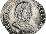 une pièce d'argent portant l'image d'un homme
