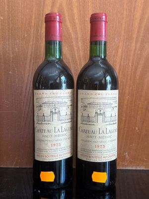 two bottles of wine sitting on a table