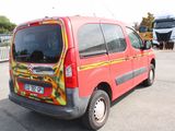a red van that has a yellow and red design on it