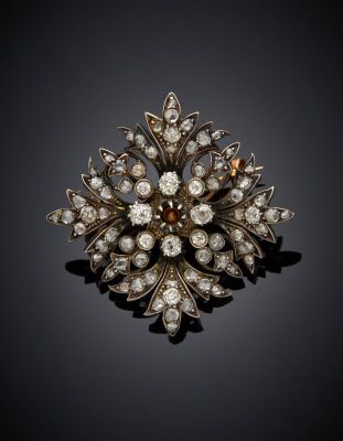 an antique diamond and gold broochle