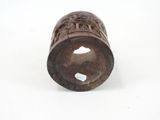an old wooden pipe with a hole in the middle on a white surface