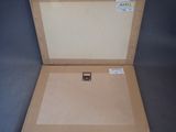 a open box with a piece of paper inside of it