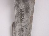 a close up of a knife with a wooden handle