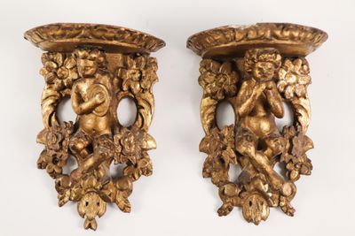 two gold colored vases with cherenshes on them