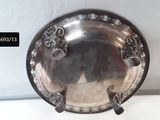 a silver plate that is sitting on a table
