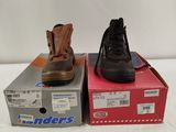 pair of men ' s work boots sitting on top of a box