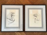 deux dessins encadrés représentant une femme et un chat sur un plancher en bois