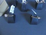 five different types of rings on display on a table