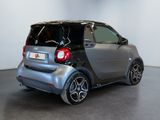 a smart car that is parked in a showroom