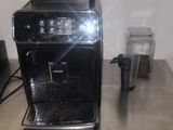 a coffee machine sitting on top of a metal table