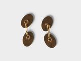 a pair of gold plated earrings on a white background