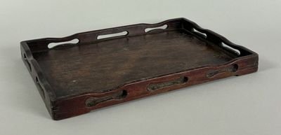 an old wooden tray with handles and handles on a table