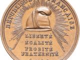 an image of a bronze medal with a hat on it