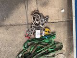 a bunch of rope and a bottle of water on the ground