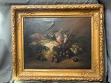 tableau représentant une nature morte composée de fruits et de légumes, dans un cadre doré