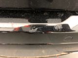 a close up of a car ' s rear bumper