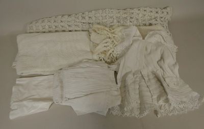 a lot of white clothing on a white surface