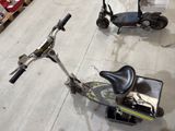 two scooters that are sitting on the floor