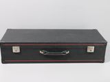 a black suitcase sitting on a white surface