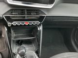 the interior of a car with a steering control and dashboard controls