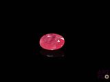 a pink diamond on a black background