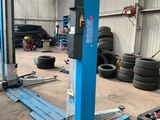 an image of a car being worked on in a garage