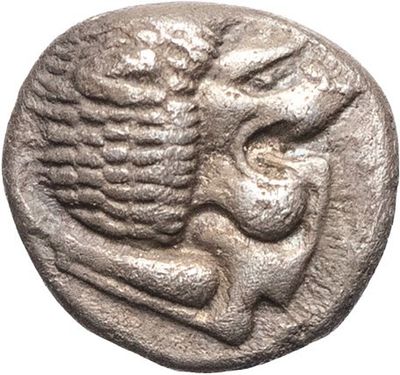 a silver coin with an image of a woman holding a child
