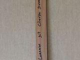 a wooden cross that has a message on it