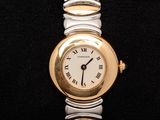 an image of a gold and silver wrist watch with roman numerals
