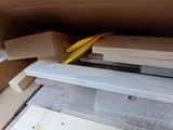 a cardboard box that has a bunch of items inside of it