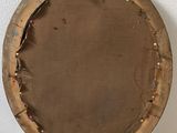 a wooden plate with a hole in the middle of it