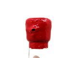 a small red object with a penny in it