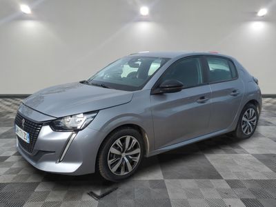 a silver car parked in a room with a checkered floor