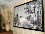a picture of a bathroom with a picture on the wall