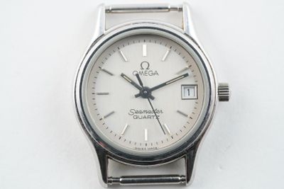 an image of a close up of a wrist watch on a white surface